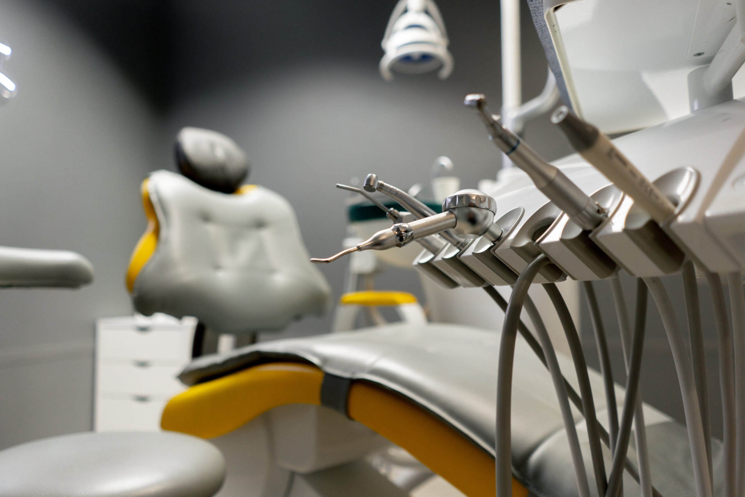dental office white sterile ready for robots yellow chair for the patient and white equipment
